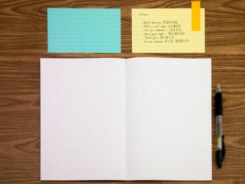Korean; Learning New Language Writing Words on the Notebook Stock Photos