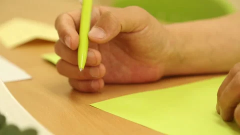 Korean Person Fidgeting with Pen while Thinking Stock Footage 333289078