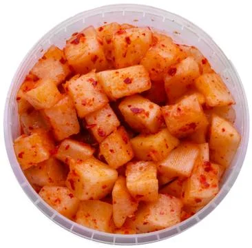 Korean radish in the package, plastic packaging, white background. Stock Photos