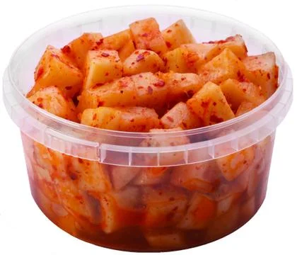 Korean radish in the package, plastic packaging, white background. Stock Photos