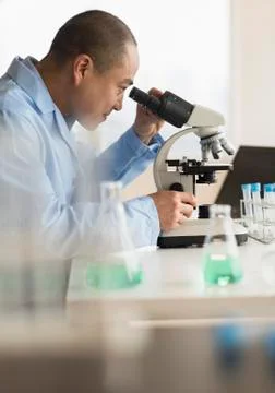 Korean scientist using microscope in laboratory 스톡 사진