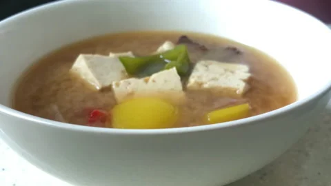 Korean soup with soybean paste and tofu in a white bowl 스톡 동영상 155427129