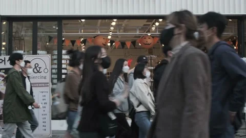 Koreans and foreigners walking around Hondae on Halloween during Covid-19 Stock Footage 164382197