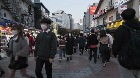 Koreans and foreigners walking around Hondae on Halloween during Covid-19 Stock Footage 164420098