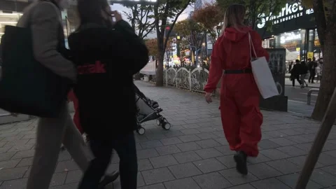 Koreans and foreigners walking around Hondae on Halloween during Covid-19 Stock Footage 164421396