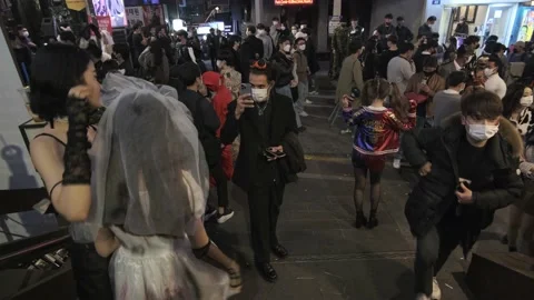 Koreans and foreigners walking around Itaewon on Halloween during Covid-19 Stock Footage 165152999