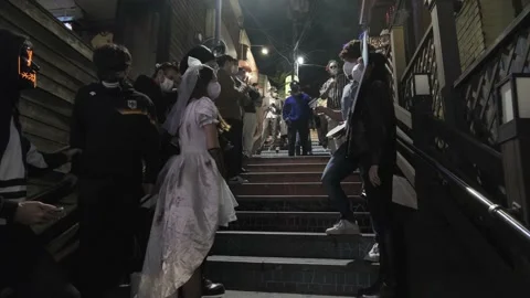 Koreans and foreigners walking around Itaewon on Halloween during Covid-19 Stock Footage 165154220