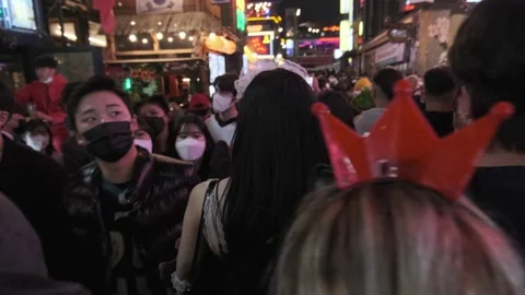 Koreans and foreigners walking around Itaewon on Halloween during Covid-19 Stock Footage 165154226