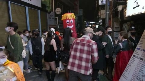 Koreans and foreigners walking around Itaewon on Halloween during Covid-19 Stock Footage 165154987