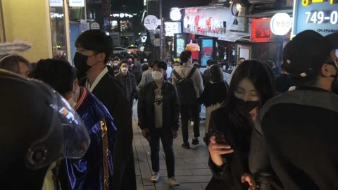 Koreans and foreigners walking around Itaewon on Halloween during Covid-19 Stock Footage 165155008