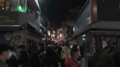 Koreans and foreigners walking around Itaewon on Halloween during Covid-19 Stock Footage 165155109