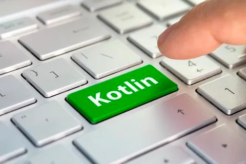 Kotlin computer language. writing on button modern of gray laptop. Finger pre Stock Photos