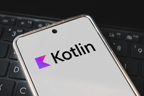 Kotlin Programming language for mobile development, concept. Smartphone on th Stock Photos