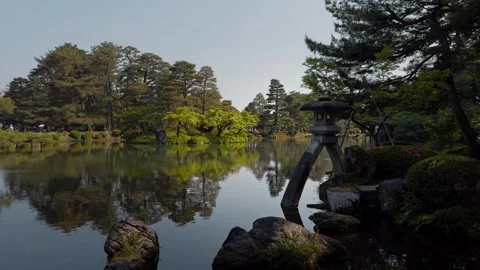 Kotoji Stone Lantern and Pond Reflections in Kenrokuen Garden, Kanazawa, Japan Stock Footage 341341153