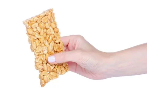 Kozinaki with peanuts in hand Stock Photos