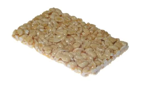 Kozinaki of peanuts on white background Stock Photos