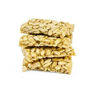 Kozinaki pile A stack of four cubes sunflower kozinaki isolated on white b... 스톡 사진