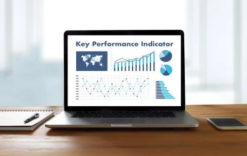 KPI acronym (Key Performance Indicator) Business team hands at work with fina Stock Photos
