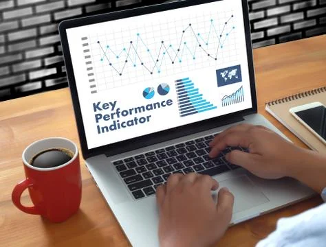 KPI acronym (Key Performance Indicator) Business team hands at work with fina Foto stock