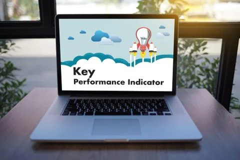 KPI acronym (Key Performance Indicator) Business team hands at work with fina Stock Photos