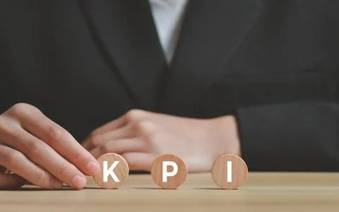 KPI (KEY KPI (KEY, Performance and Indicator) with icon on wooden cube, bu... Stock Photos