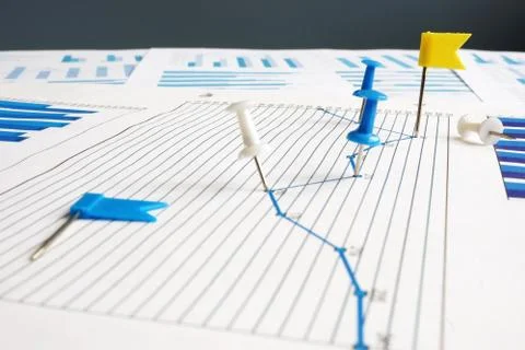 KPI key performance indicators. Thumb tacks and business papers. Stock Photos