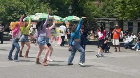Kpop dancing troupe dance camera filming Washington Square Park New York City NY Stock Footage 242976354
