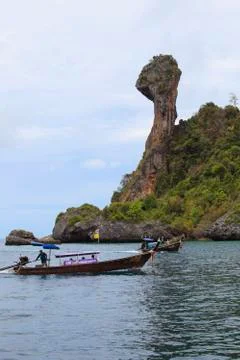 Krabi,thailand-apri l16,2013: boats taking group of visitor past koh kai isla Stock Photos
