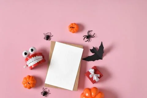 Kraft envelope next to various decorations for the Halloween holiday on a pin Stock Photos