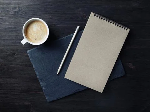 Kraft notepad, pencil, coffee cup Stock Photos