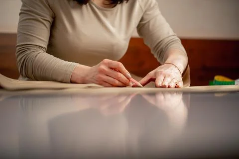 With kraft paper to draw future patterns for a dress Stock Photos