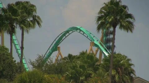 Kraken Rollercoaster Going Down First Drop with Corkscrew Stock Footage 21928249