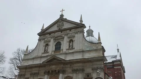Krakow, Poland, A large clock tower in front of a building Stock Footage 134292238