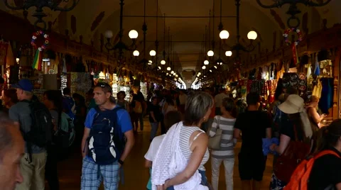 Krakow, Poland: Tourist shopping souvenir in Krakow cloth hall market Stock Footage