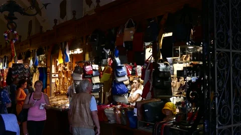 Krakow, Poland: Tourist shopping souvenir in Krakow cloth hall market Stock Footage