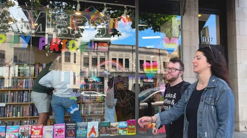 Kramers window with Pride message and browsing customers Video stock 323712117