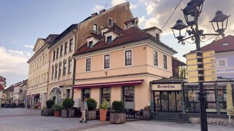 Kranj old town pedestrian square with Mlečna cafe, outdoor seating, pastel Stock Footage 339092525
