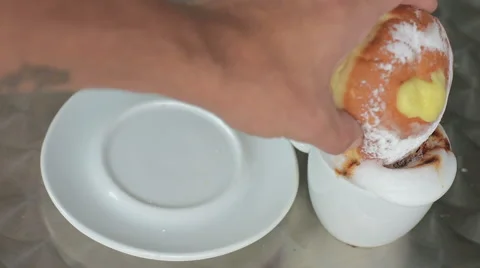 Krapfen inside a cappuccino Video stock 68378733