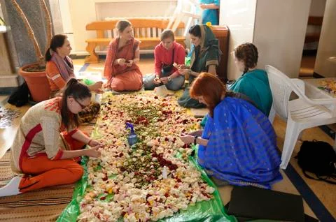 Krishna temple female workers preparing Prasad - food that is a religious off Stock Photos