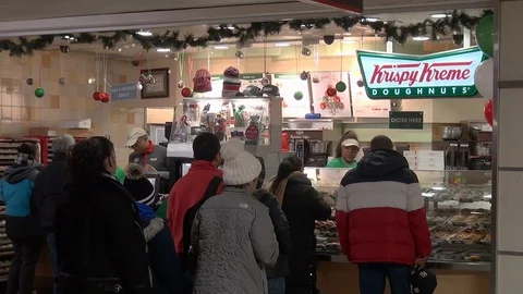 Krispy Kreme Customers Form Long Line in Manhattan's Penn Station Stock Footage 100565674