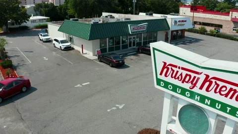 Krispy Kreme Doughnut restaurant store. Aerial of drive through retail Stock Footage 156789078