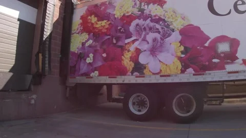 Kroger retail store and trailer parked at dock in back of building Stock Footage 181809375