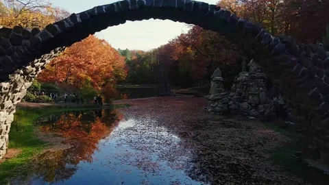 Kromlau, Devil's Bridge. Autumn scenery. Drone footag Stock Footage 234406311
