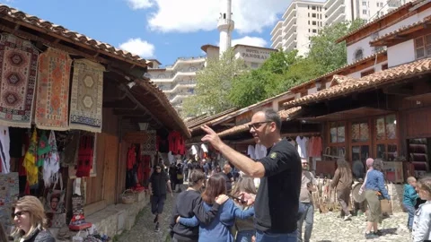 Kruja Old Bazaar Crowd Between Rug Stalls and Minaret Albania 스톡 동영상 345008953
