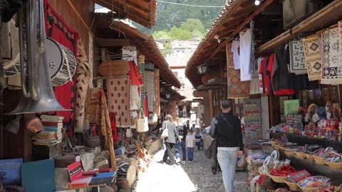 Kruja Old Bazaar Wooden Shops Hanging Rugs and Shoppers Albania Видео 345008967