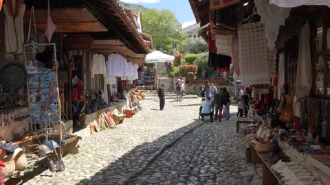 Kruje Old Bazaar cobblestone street with souvenir stalls Albania Stock Footage 345802735