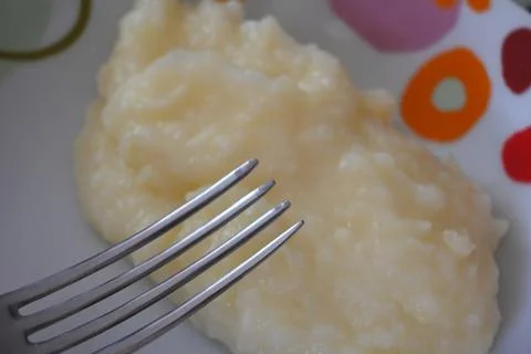 Krumplipure on a plate with a fork Stock Photos
