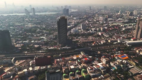 Krung Thon Buri Road and BTS Skytrain aerial view at sunrise. Busy city streets 스톡 동영상 302808809
