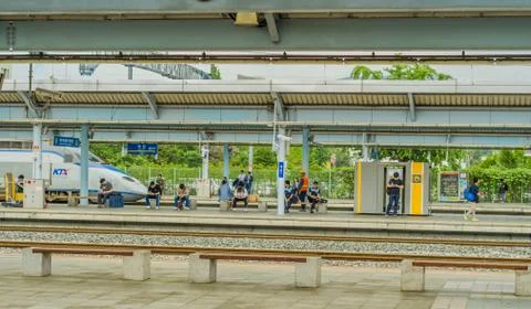 KTX train pulling up to platform Stock Photos
