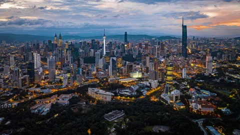 Kuala Lumpur city skyline with dramatic sky , twilight scene . Malaysia . Stock Footage 251160115